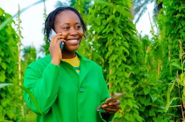 Happy Digi Farmer on call with her customers
